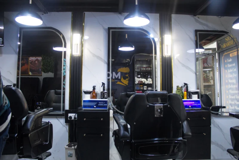 Signature Barbershop with black barber chairs and mirrors