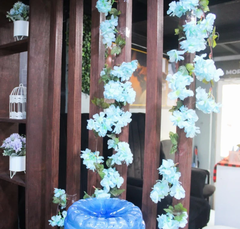 Wooden slat screen wrapped in pale blue flowers